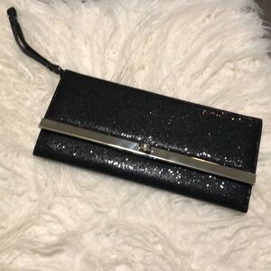Black clutch party handbag 9x4 inches.